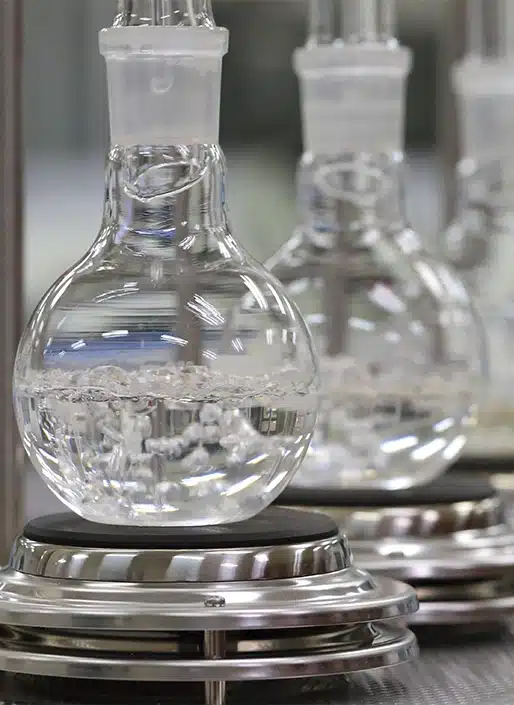 Clear bottle with clear liquid bubbling inside