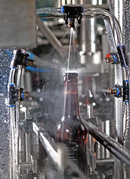 Water spray on glass bottle