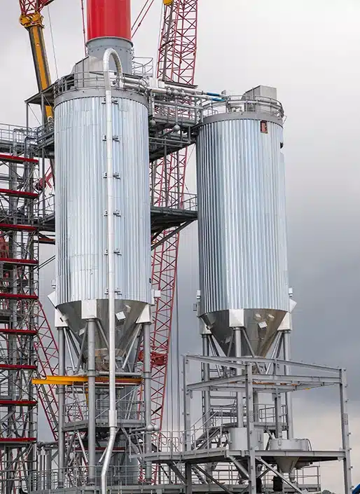 Two large ribbed metal tanks